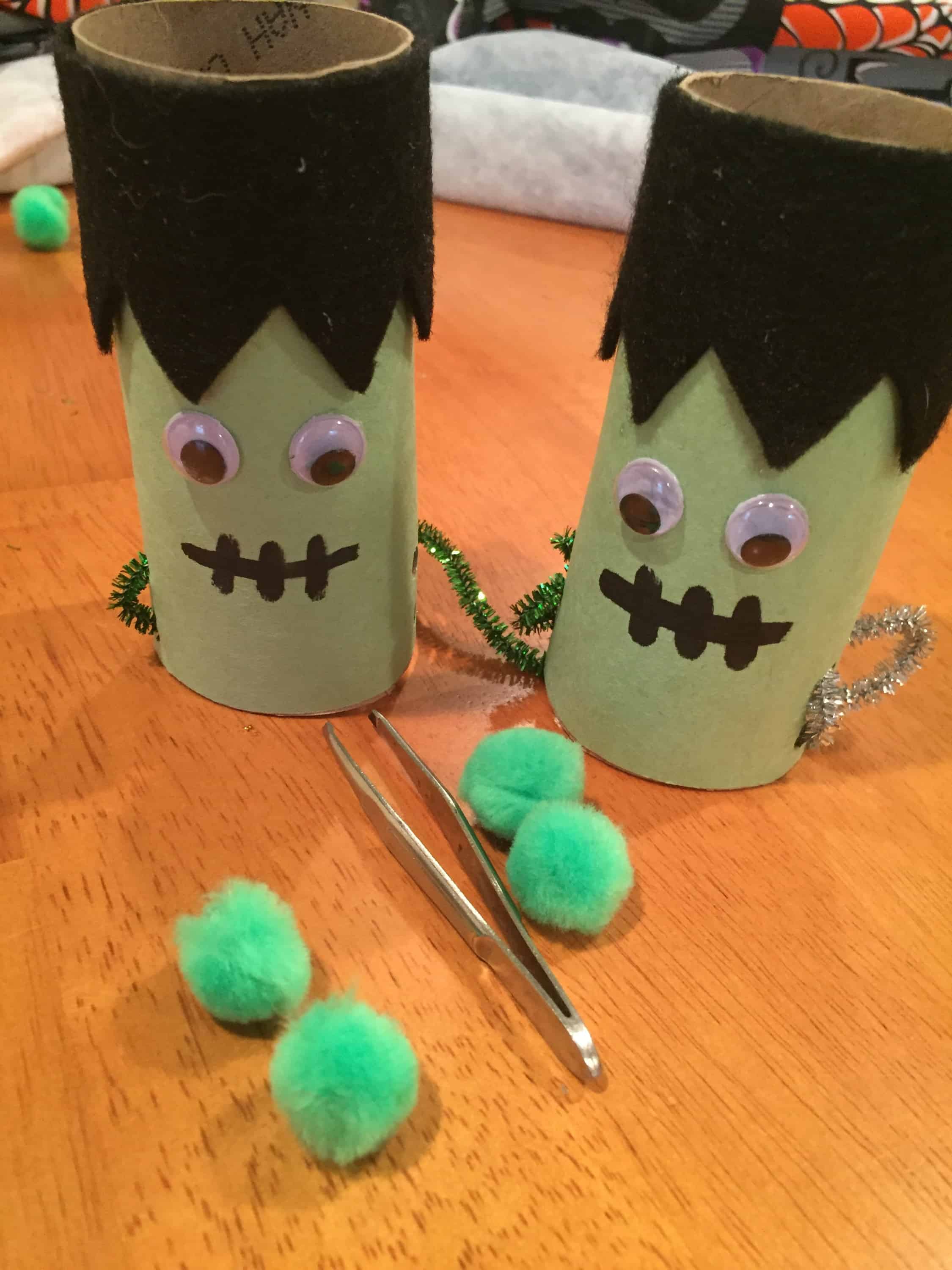 This simple up cycled Halloween craft is perfect for fine motor practice and serves as a great homemade game! Doubles as cute decor!