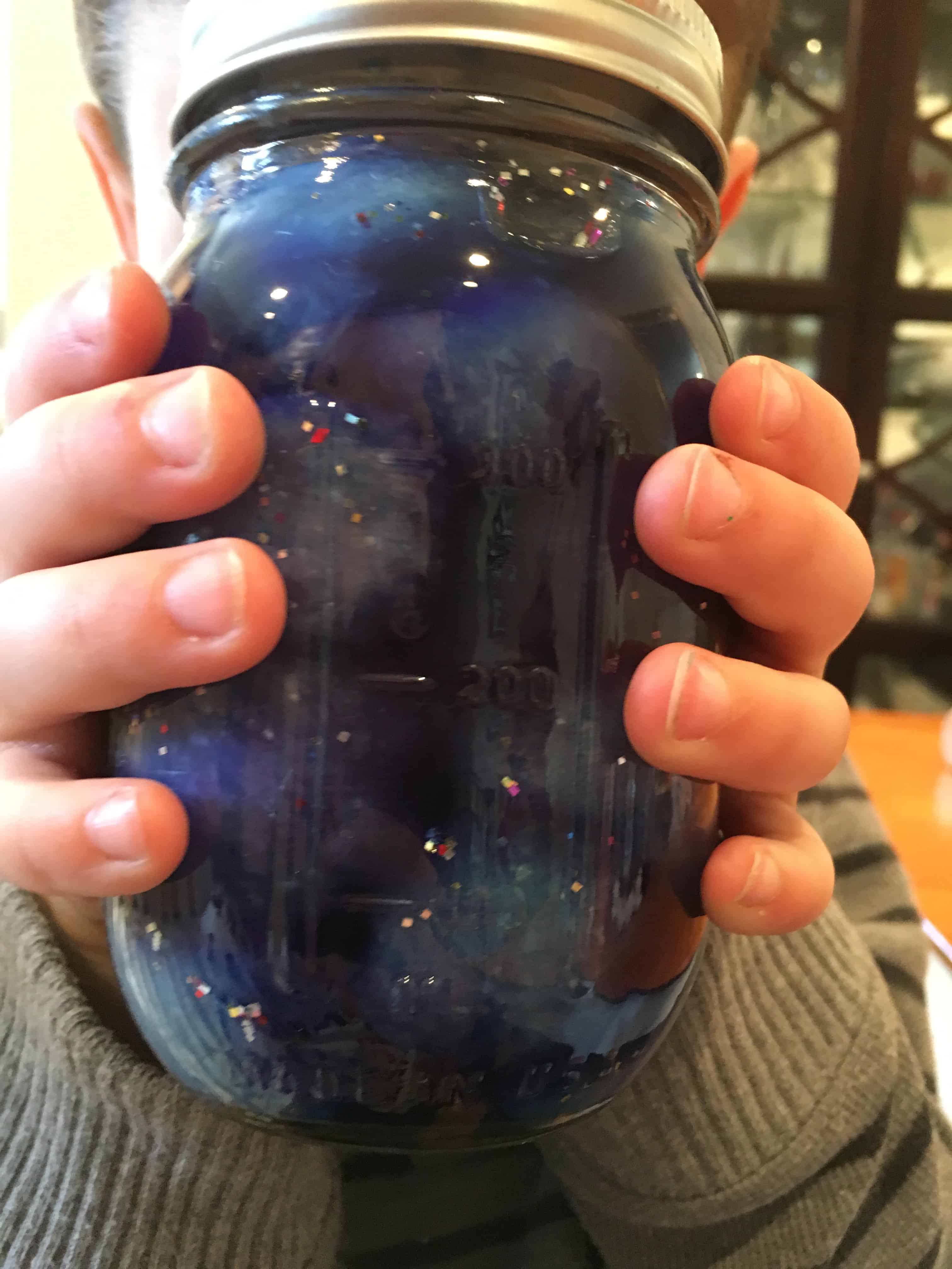 How cool is this nebula calm down jar?!? It is super easy to make and a wonderful sensory tool that can be used when kids are experiencing intense emotions.