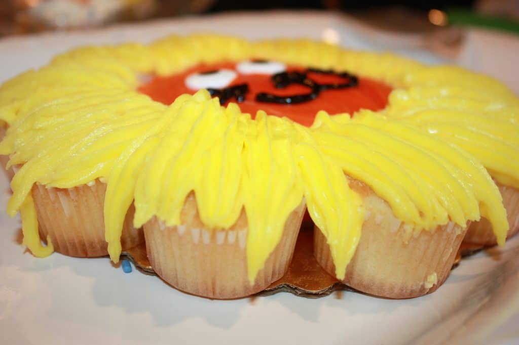 The adults ate the cupcakes, and the face was perfect as a The adults ate the cupcakes, and the face was perfect as a