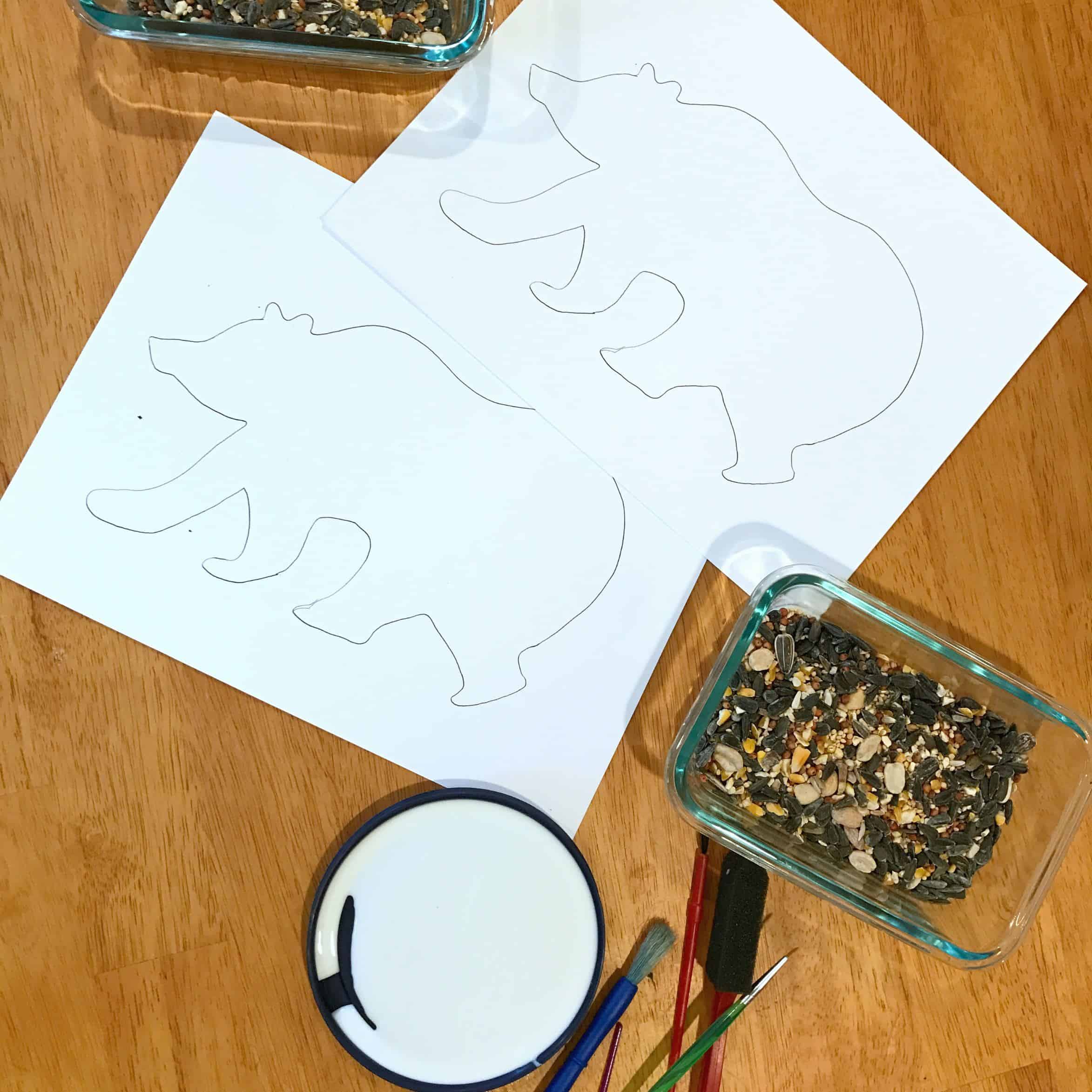 This simple bear craft for kids uses bird seed on a simple drawn bear outline. Grab the free printable template and get crafting! 