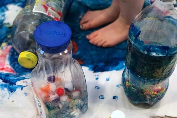 This sensory process art activity uses recycled materials and the exploration of weight to create art! 