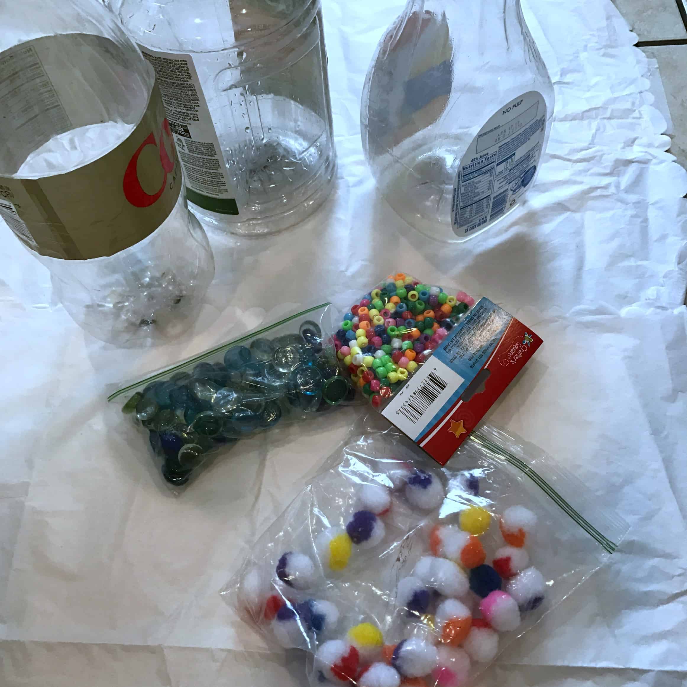 This sensory process art activity uses recycled materials and the exploration of weight to create art! 