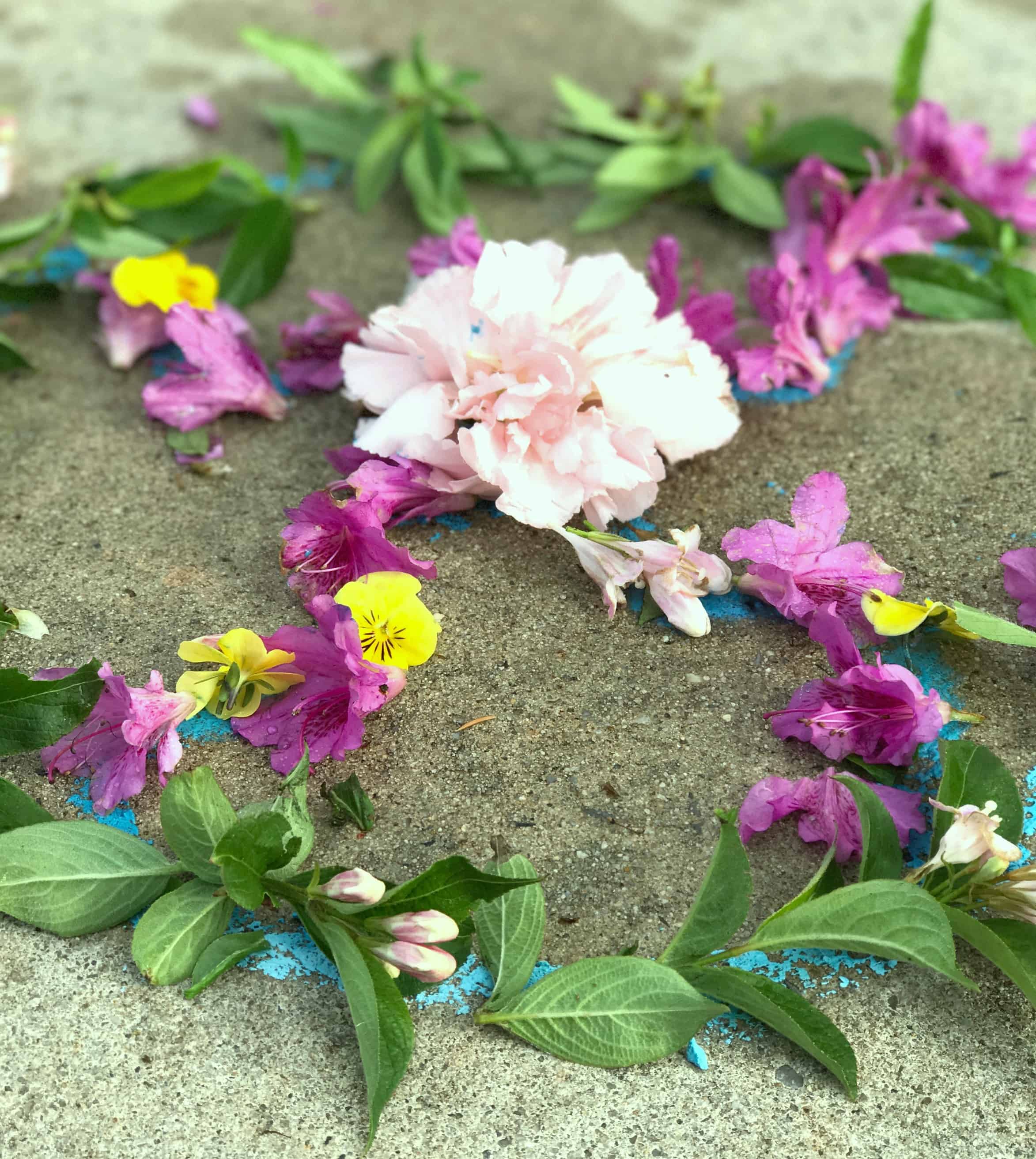 Making this flower mandala process art is a great way to get kids outdoors creating! They turned out so beautiful, and using a chalk template made these doable for even young children. 