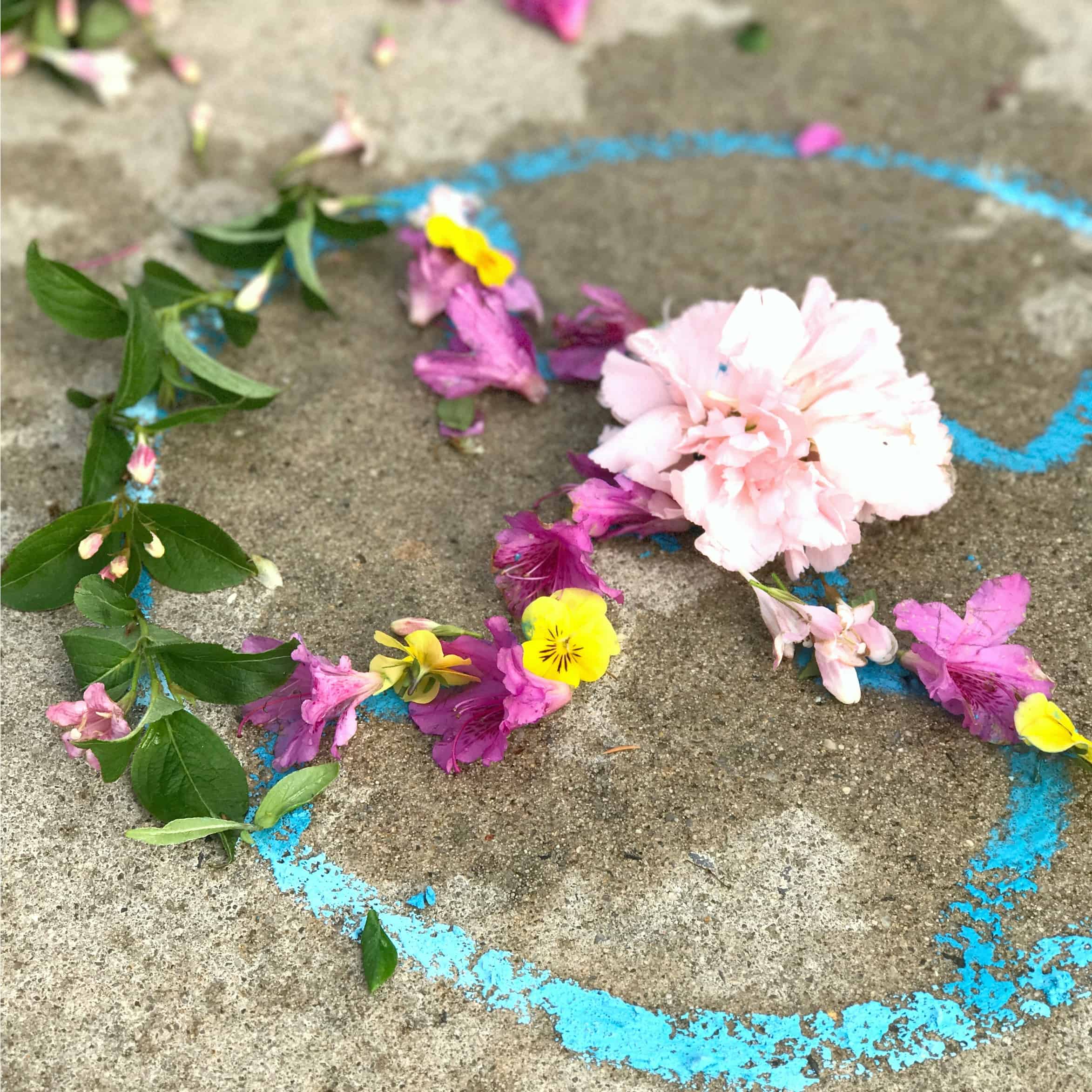 Making this flower mandala process art is a great way to get kids outdoors creating! They turned out so beautiful, and using a chalk template made these doable for even young children. 