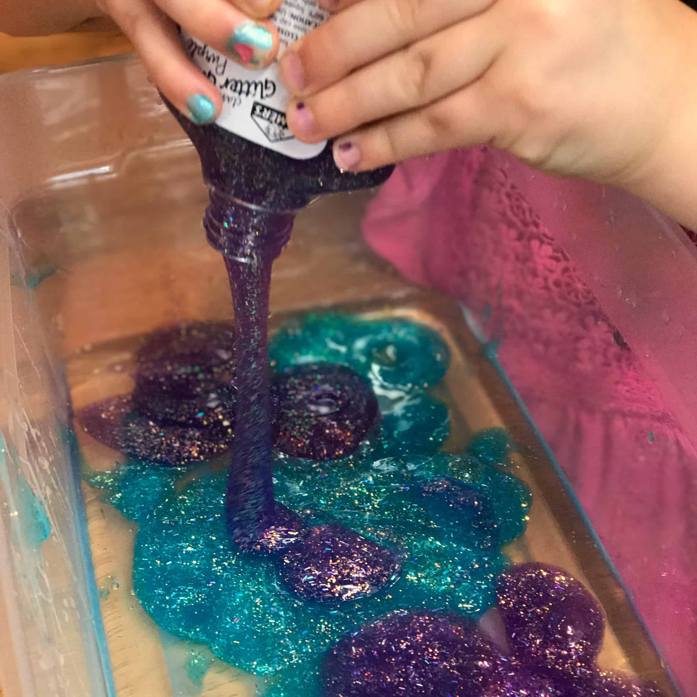 This Moana ocean slime has the perfect texture for sensory play and is made without borax, using contact solution instead with Moana toys and shells. Borax-free slime perfect for sensory play for kids. 