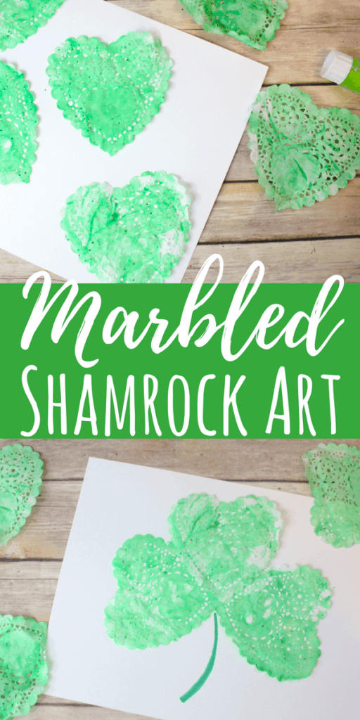 This marbled Shamrock art is such a fun process art project for kids! Using shaving cream, paint and paper doilies, these are simple for all ages. #stpatricksday #processart #shamrockart #kidscrafts #holidayswithkids