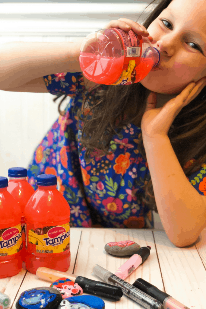 girl drinking tampico juice